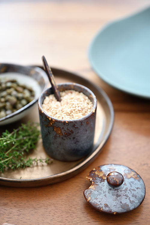 ceramic jar for spices and seasonings on the table