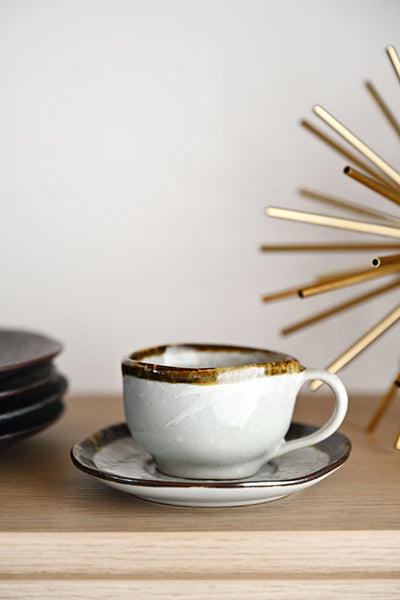 A Free-Form Cup and Coaster Set, suitable for drinks both hot and cold. A perfect addition to your ceramic tableware collection.
