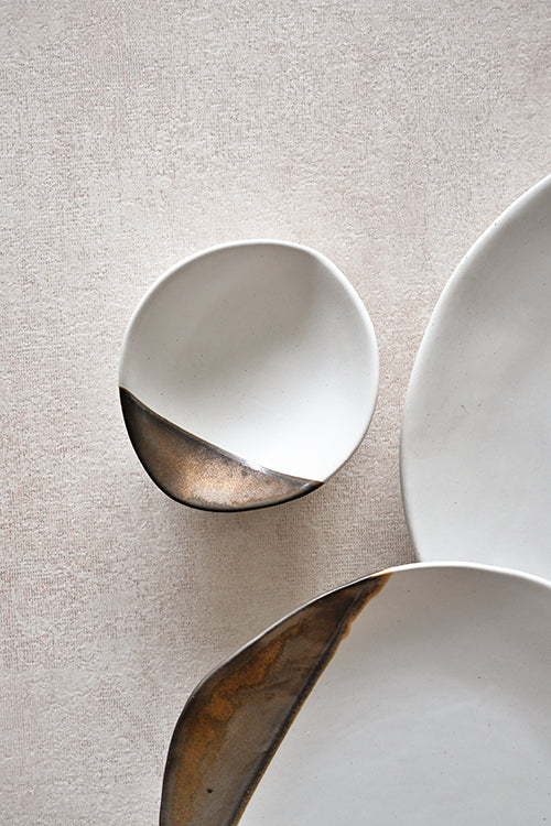 Overhead view of gold leaf ceramic shell dish, 12cm
