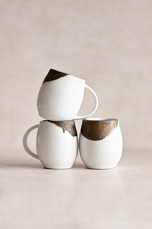 Handmade gold leaf ceramic mug with bronze-dipped rim