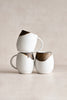 Handmade gold leaf ceramic mug with bronze-dipped rim