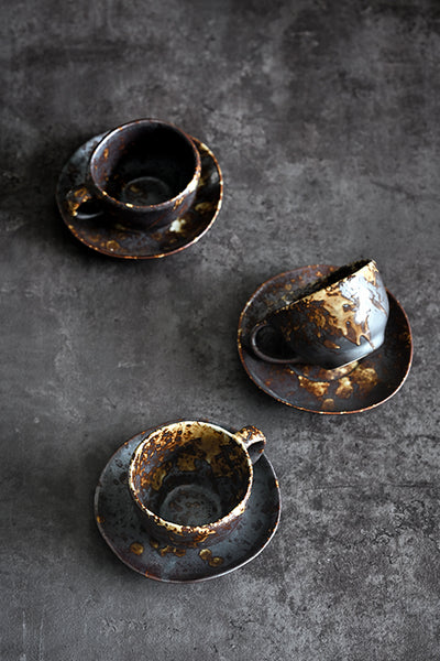 Handmade ceramic Charcoal Grill cup and saucer with textured dark glaze