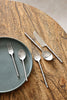 Brushed steel hand-forged stainless steel cutlery set with sculpted segmented handles — Kra Sanctuary