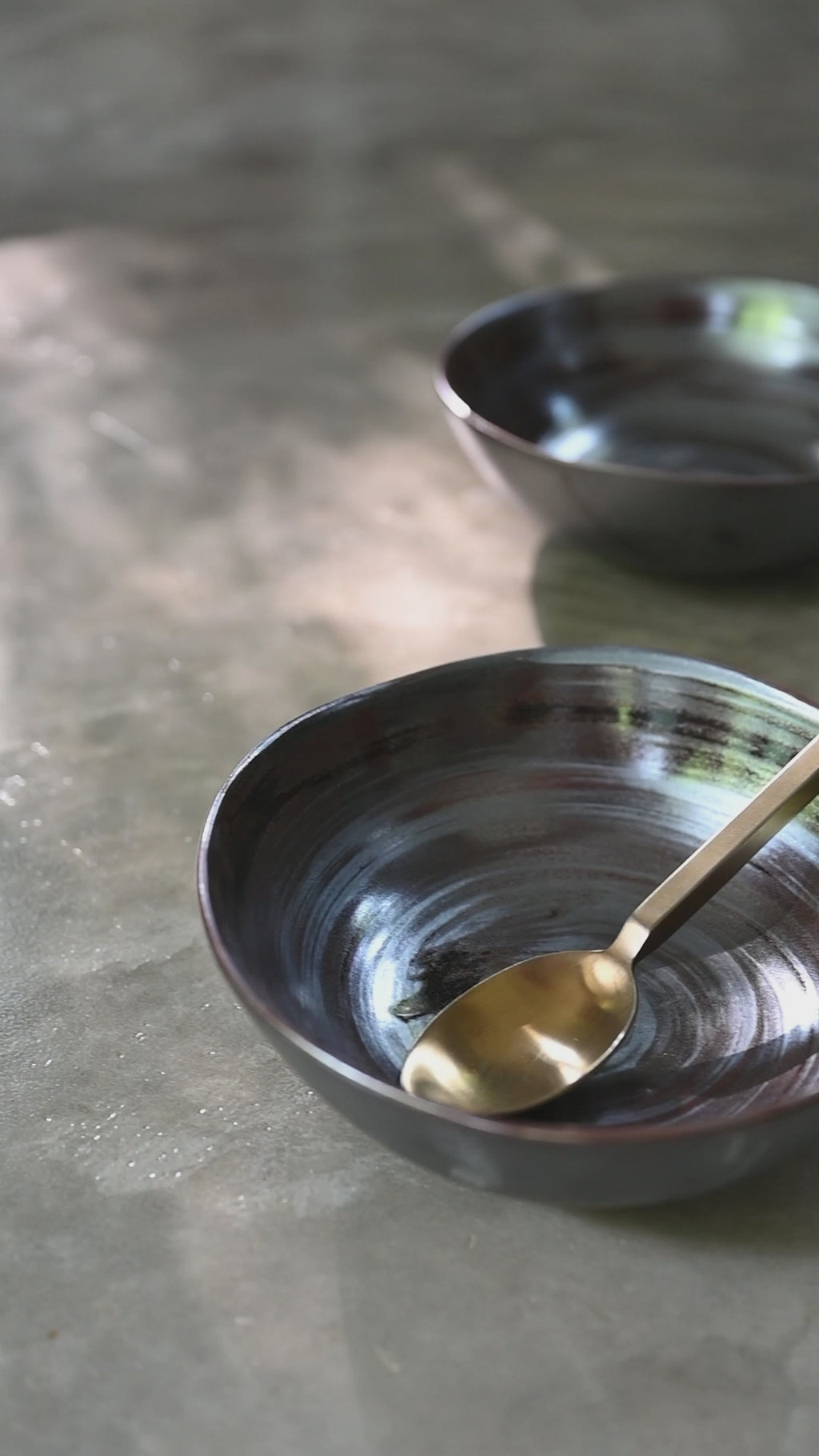 Handmade 18 cm charcoal ceramic bowl with organic free-form shape, swirled semi-gloss glaze, for soup, noodles, cereal and sides