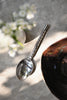 Hand-forged polished silver stainless steel serving spoon, 23 cm, twisted hammered handle with teardrop end, for curries and sharing dishes